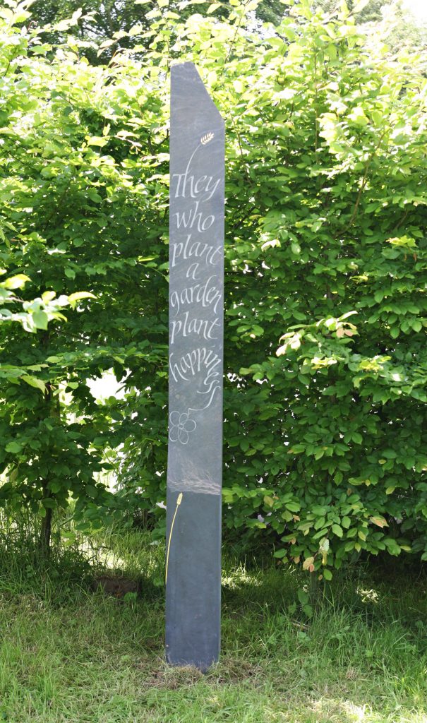 'They who plant a garden' Welsh Slate standing stone.